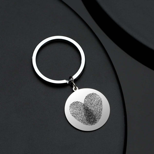 Personalised engraved fingerprint keyring presented in gift‑ready packaging, perfect as a thoughtful personalised gift