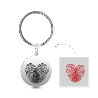 Personalised double‑fingerprint keyring pictured on keys to show scale, a handmade engraved fingerprint keepsake ideal for anniversaries or Christmas