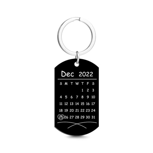 Personalised photo calendar keyring in stainless steel showing a colour photo with a highlighted custom date — anniversary keepsake for couples