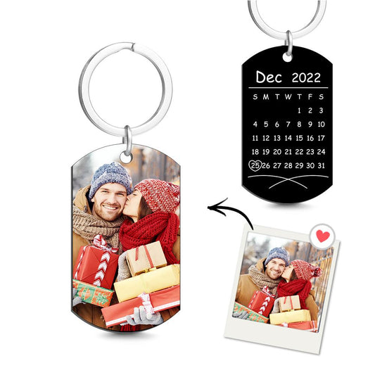 Personalised photo calendar keyring in stainless steel showing a colour photo with a highlighted custom date — anniversary keepsake for couples