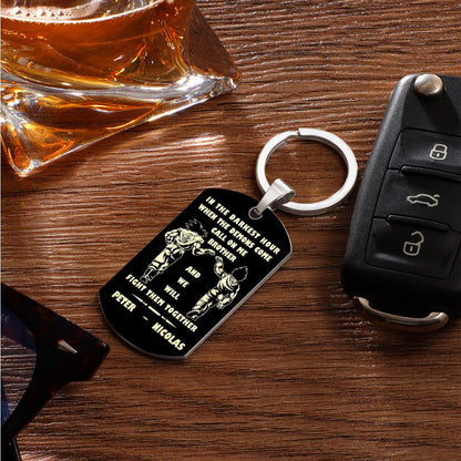 Keyring shown paired with personal items to illustrate scale — compact personalised stainless steel engraved tag for pockets or bags.