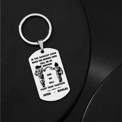 Styled arrangement showing the Call On Me Brother engraved tag alongside a pen and keys — everyday personalised keyring idea.