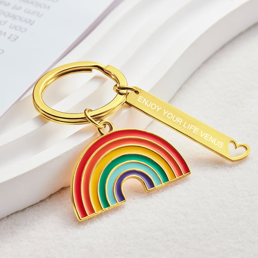 Personalised gold rainbow pendant keyring on white background – bedazzled alloy with gold finish, engraved keyring gift for him or her