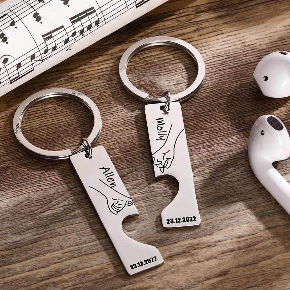 Close up polished stainless steel heart keyrings personalised with names ideal anniversary gift