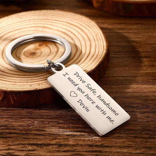 Personalised engraved stainless steel keyring on split ring, brushed finish rectangular tag reading ‘Drive Safe Handsome I Need You Here’ — durable travel keepsake gift for him