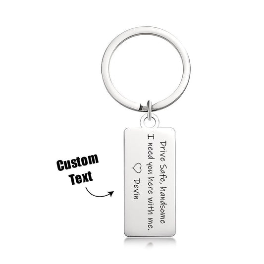 Personalised engraved stainless steel keyring on split ring, brushed finish rectangular tag reading ‘Drive Safe Handsome I Need You Here’ — durable travel keepsake gift for him