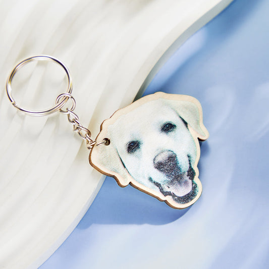 Pair of personalised wooden pet photo keychains displaying custom dog and cat engravings, ideal memorial gifts and keepsake keyrings