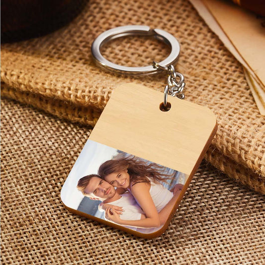 Handcrafted personalised wooden photo keyring laid flat to display photo and engraving, ideal personalised gift for birthdays, anniversaries and Mother's Day