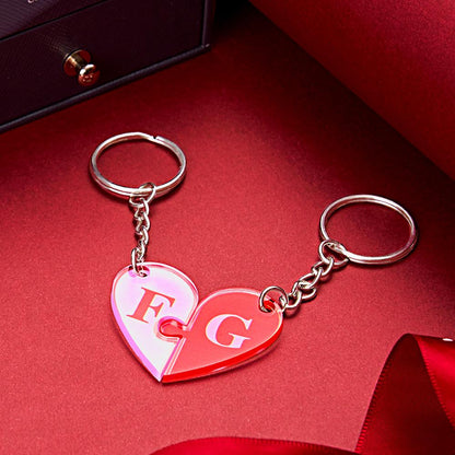 Close up of personalised initial engraving on heart puzzle keyring pendant showing neat engraving and interlocking design