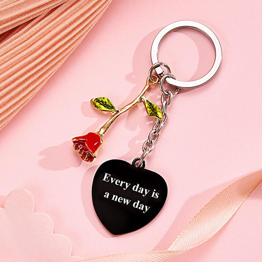 Styled shot of personalised rose pendant heart keyring on keys to show scale — stylish engraved photo or music keepsake, great for graduation, Christmas or anniversary gifts for her