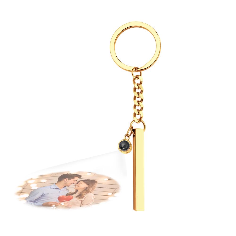 Personalised Photo Projection Keyring shown with smartphone camera demonstrating the micro-photo projection effect – unique engraved cube pendant gift
