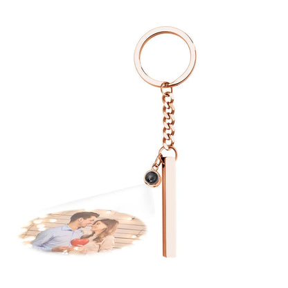 Engraved cube pendant keyring presented on a neutral background, emphasising the polished metal and customisation area – personalised photo gift