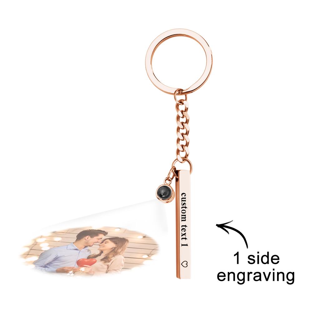 Personalised Photo Projection Keyring in-hand to show portability and everyday use – engraved vertical cube pendant on a steel keyring