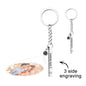 Close-up of the steel personalised keyring cube highlighting the engraved text area and smooth polished surface – engraved cube pendant gift idea