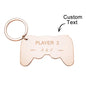 Close-up of engraved gamepad charm showing detailed controller buttons and custom name engraving on a personalised gamer keychain