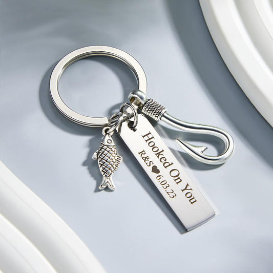 Personalised fish hook keyring attached to a set of keys highlighting the hooked design and sturdy clasp — durable customised fishing keepsake for birthdays, anniversaries and Father’s Day