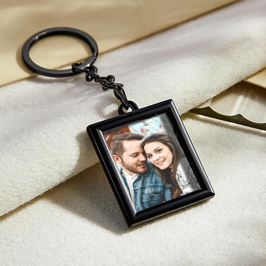 Personalised photo keychain close-up — minimalist rectangular photo frame keyring with a clear portrait insert, perfect personalised photo gift