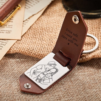 Close‑up of engraved stainless‑steel plate and soft leather strap on a personalised photo keyring — engraved leather keepsake, perfect gift for him