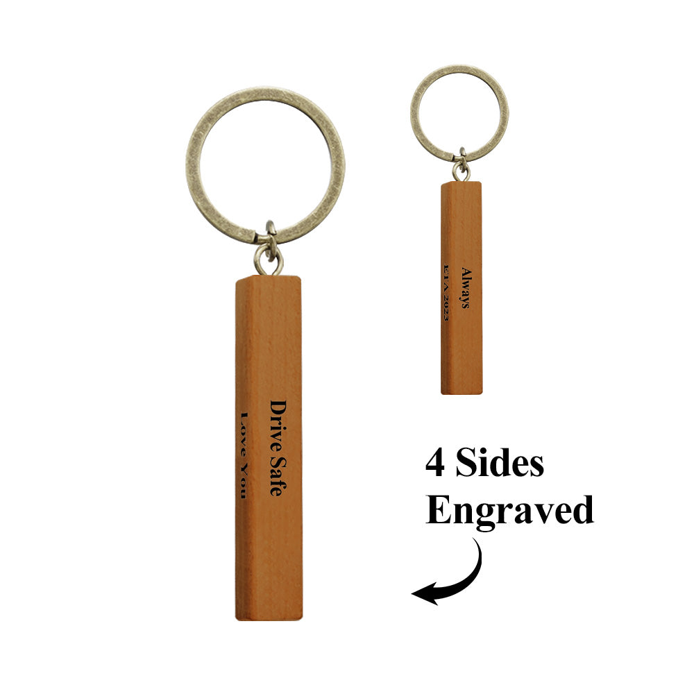 Front view of personalised wood bar keyring variant A showing engraved message, clean wood grain and neat finished edges