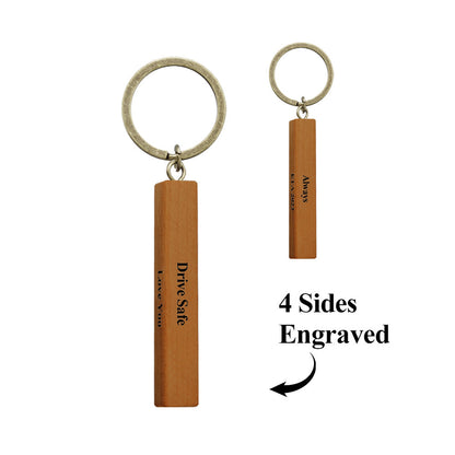 Front view of personalised wood bar keyring variant A showing engraved message, clean wood grain and neat finished edges
