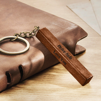 Personalised wood bar keyring variant B – darker wood finish with four engraved sides for names, dates or short messages