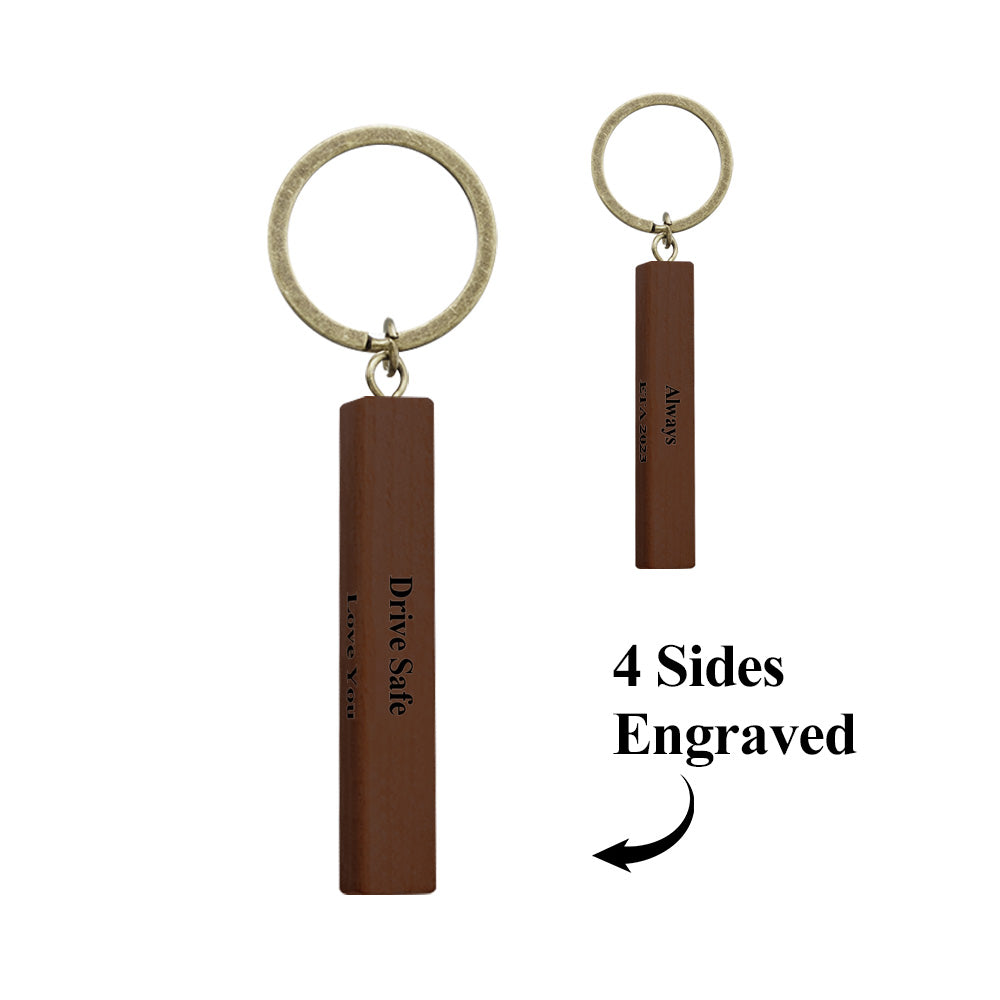 Angled view of engraved wooden keyring variant B showing deep, precise engraving and sturdy metal ring ideal as a personalised gift