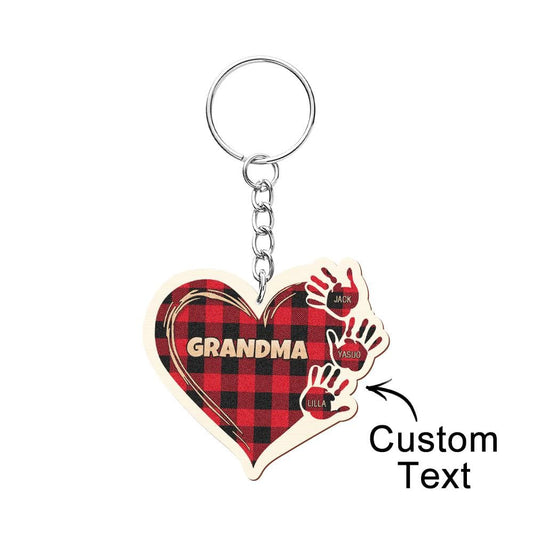 Personalised kids name keyring — hand-shaped wooden charm engraved with child's name on a durable metal split ring