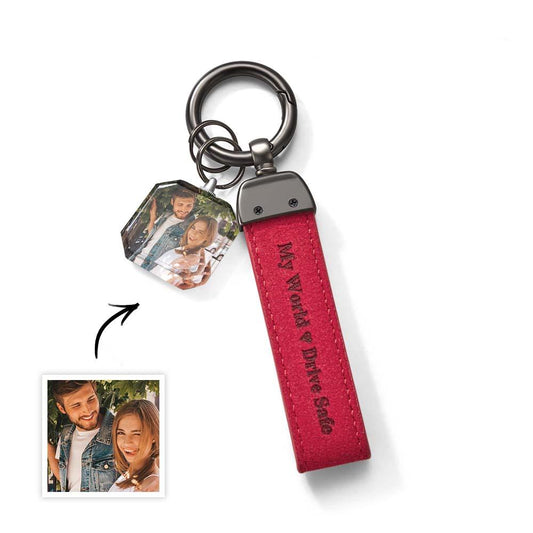 Angled view of personalised crystal photo keyring 'Drive Safe My Love' highlighting engraving depth and clarity