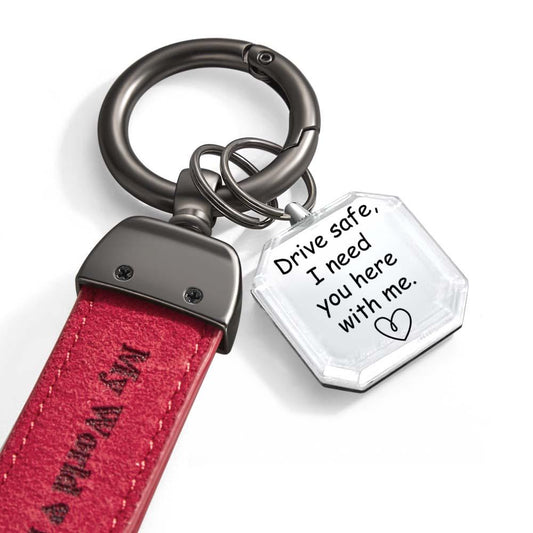 Angled view of personalised crystal photo keyring 'Drive Safe My Love' highlighting engraving depth and clarity