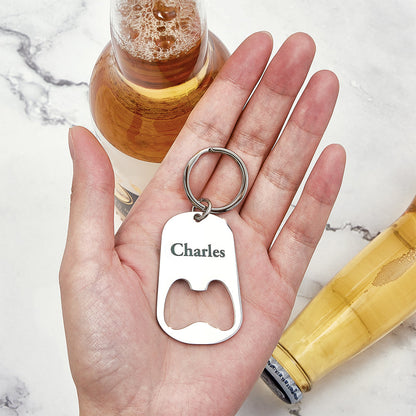 Personalised calendar keyring bottle opener held in hand to show scale and everyday use as an engraved save-the-date keepsake