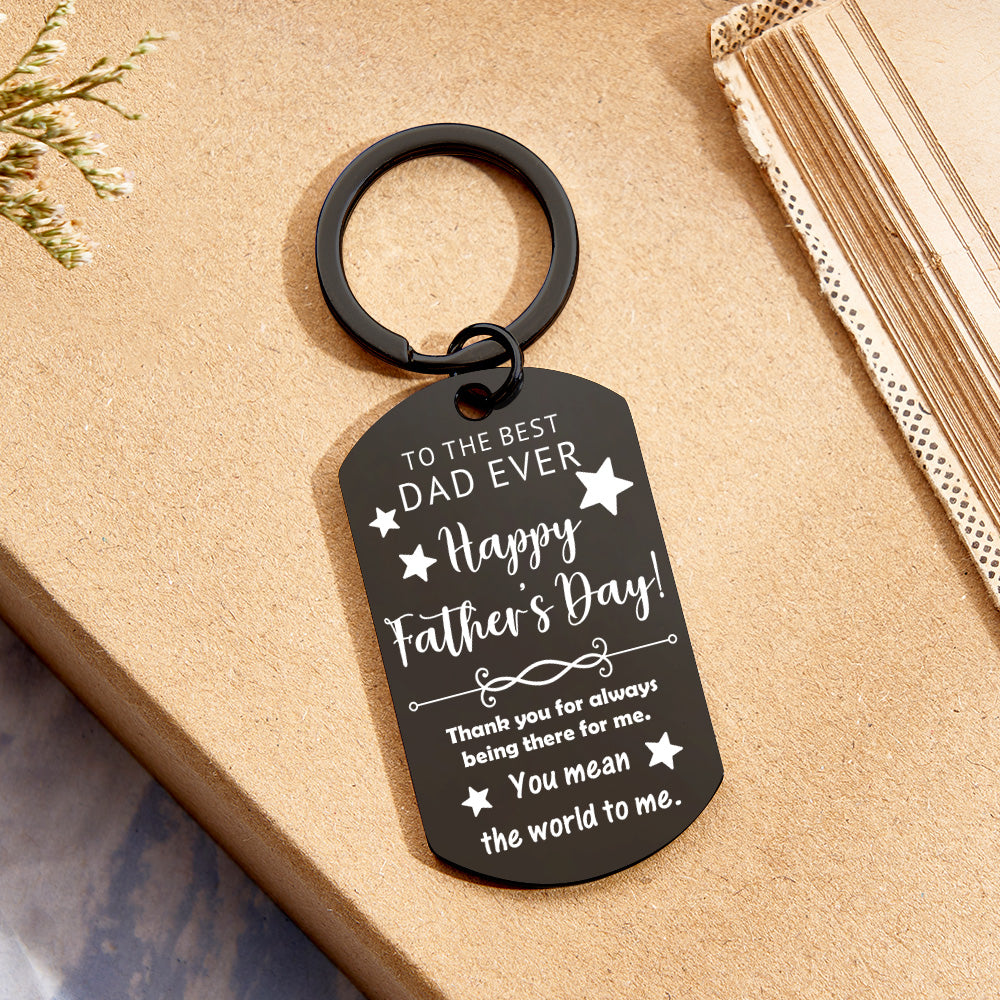 Close-up of round personalised keychain with printed photo and custom text — sentimental personalised gift for Dad
