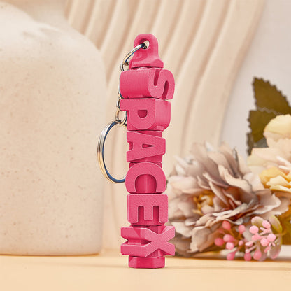 Personalised name keychain attached to a bag zip – colourful 3D printed custom tag for quick luggage identification