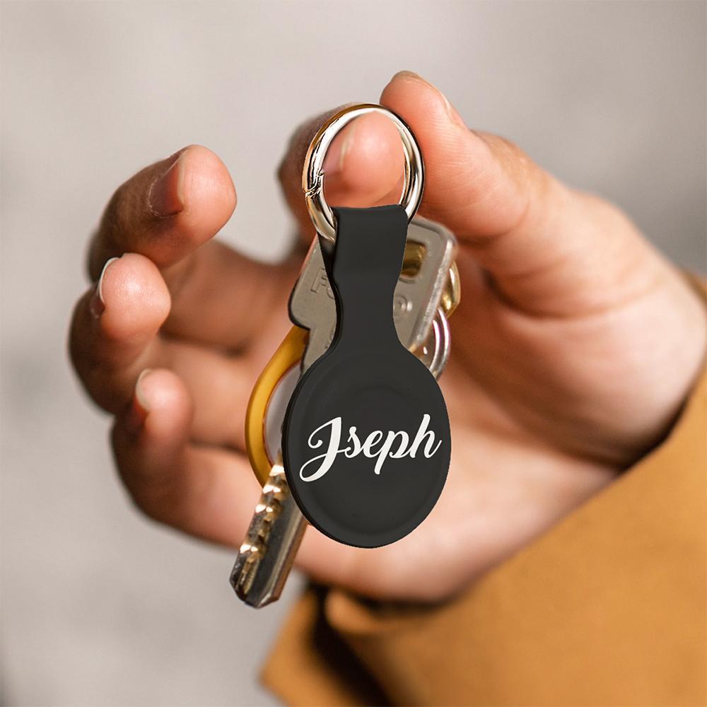 Silicone personalised AirTag case attached to a child’s schoolbag — custom AirTag keyring to help keep track of belongings and loved ones