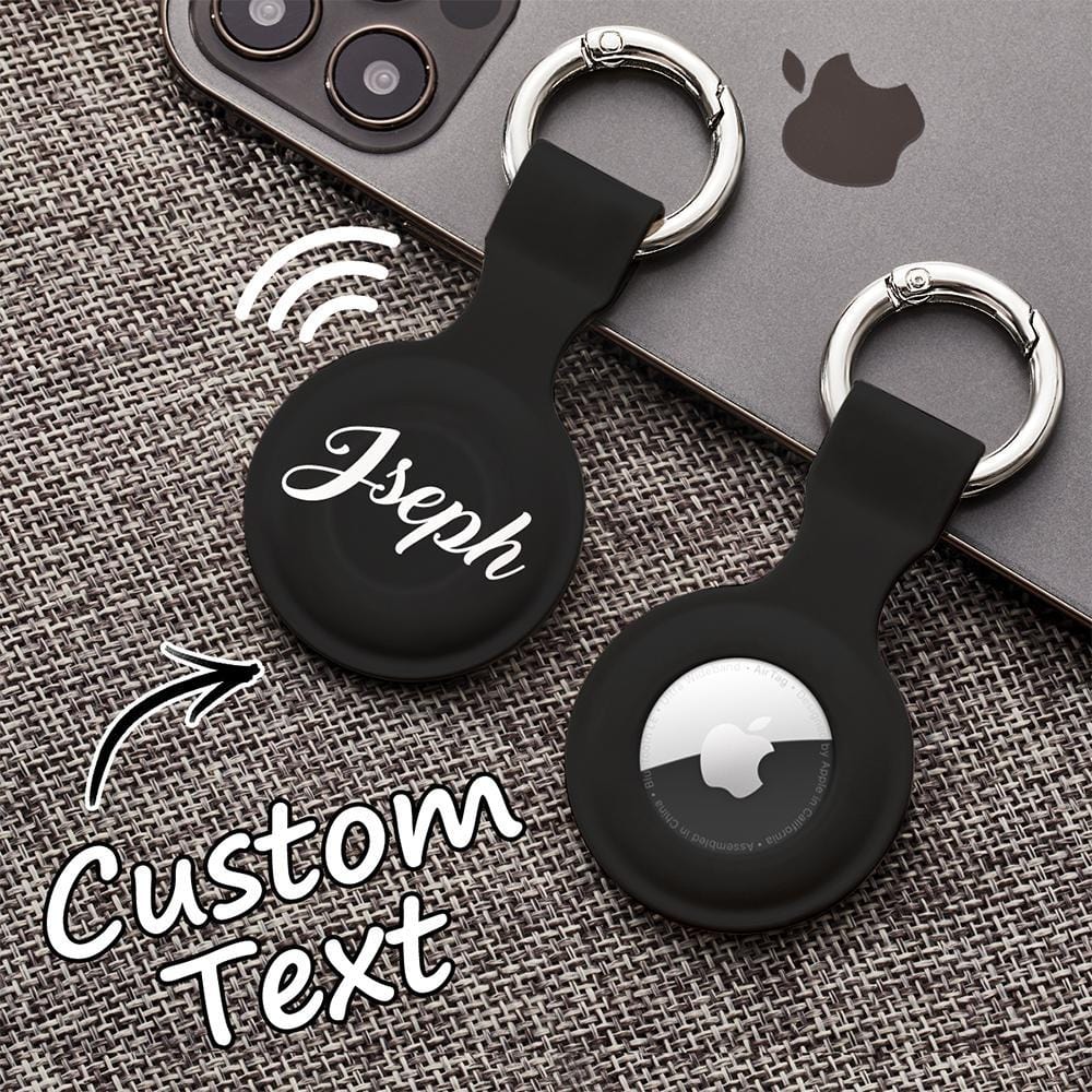 Personalised AirTag holder clipped to a handbag strap — custom silicone protector and keyring for everyday tracking and thoughtful gifting