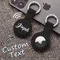 Personalised AirTag holder clipped to a handbag strap — custom silicone protector and keyring for everyday tracking and thoughtful gifting