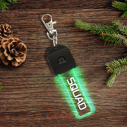 Close-up of UV-printed clear acrylic keyring showing gradient LED glow and personalised options