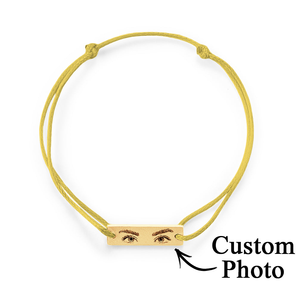 Wrist shot showing adjustable personalised eyes bracelet worn as a sentimental anniversary or memorial gift
