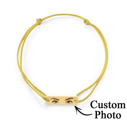 Wrist shot showing adjustable personalised eyes bracelet worn as a sentimental anniversary or memorial gift
