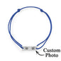 Engraved charm against soft fabric, illustrating clarity of custom photo engraving on personalised eyes bracelet