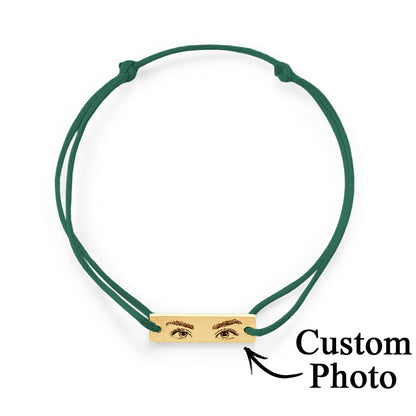 Personalised Eyes Photo Bracelet displayed beside a photo used for engraving, emphasising customisation process