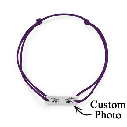 Styled product shot for Valentines and anniversaries — personalised engraved eye bracelet as an intimate love gift