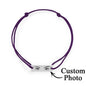 Styled product shot for Valentines and anniversaries — personalised engraved eye bracelet as an intimate love gift