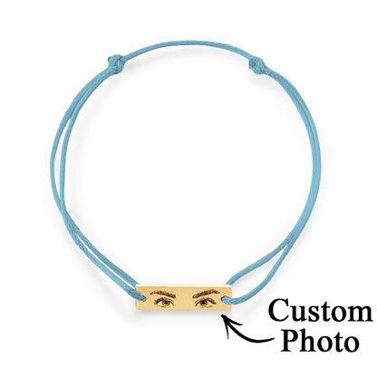 Studio image showing engraving contrast and durability of the stainless steel charm on personalised eyes bracelet