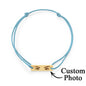 Studio image showing engraving contrast and durability of the stainless steel charm on personalised eyes bracelet