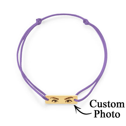 Hand-tied knot detail and neat finishing of the adjustable silk cord on personalised eyes photo bracelet