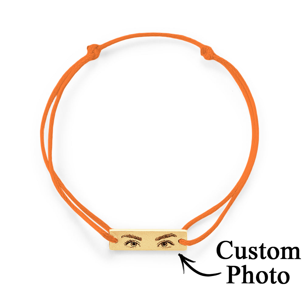 Macro shot highlighting engraved eyelash definition and shading on the personalised eyes photo bracelet charm