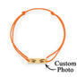 Macro shot highlighting engraved eyelash definition and shading on the personalised eyes photo bracelet charm