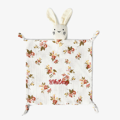 Angled view highlighting embroidery area on the baby comforter