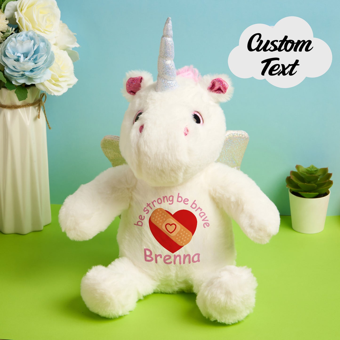 Detailed view of embroidered birth announcement text on personalised unicorn teddy, ideal newborn keepsake and nursery decor