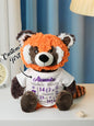 Hand-held scale demonstration showing personalised plush size for nursery and travel — compact personalised baby gift
